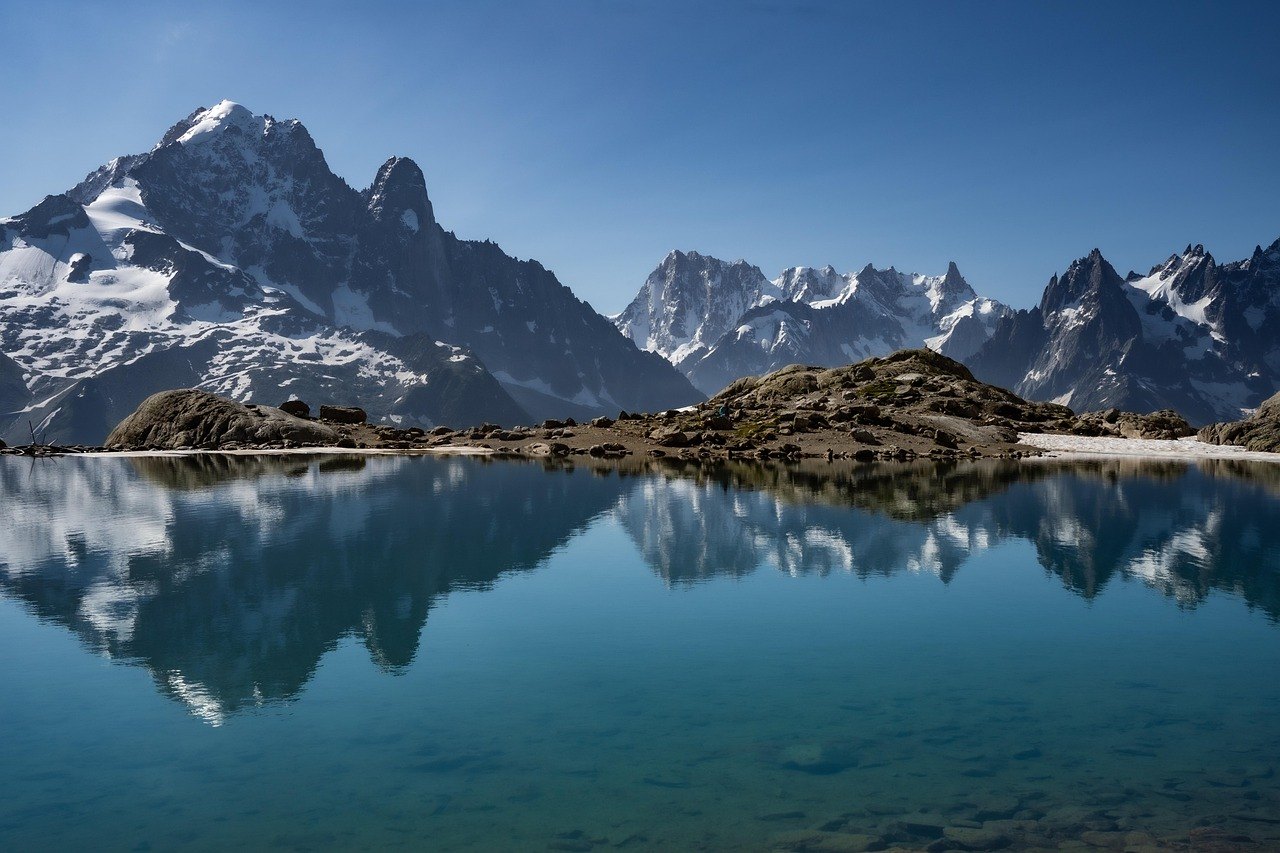 Mountain lake reflecting the Aiguilles near Chamonix